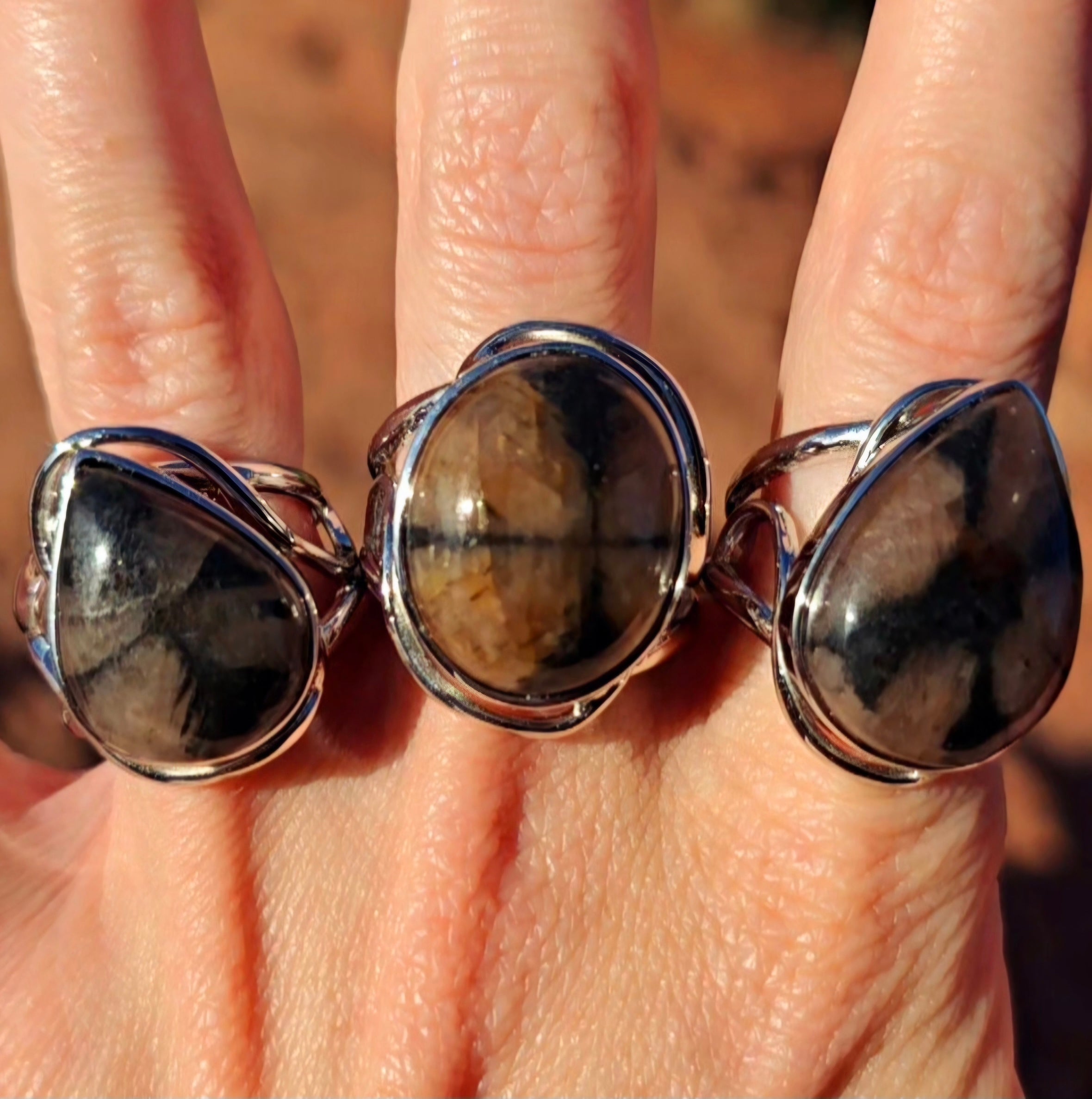 Enchanting Chiastolite Cuff Rings